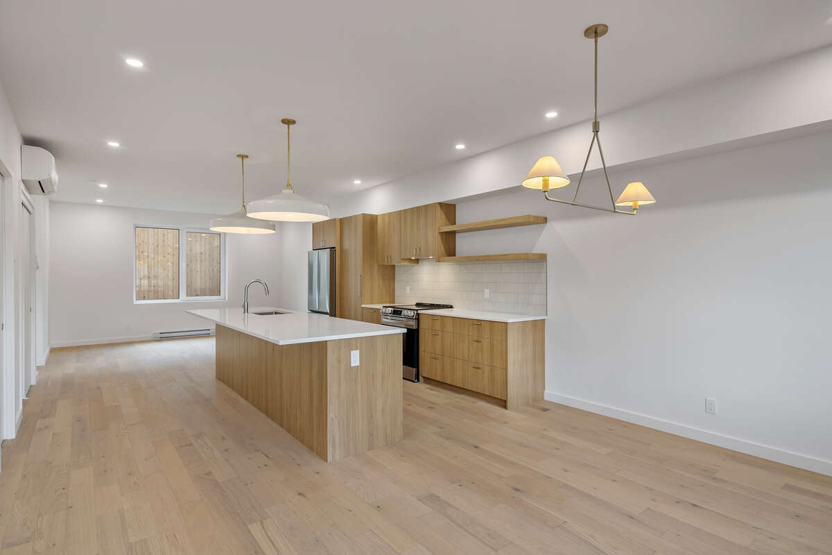 Own your own strata free townhome with backyard