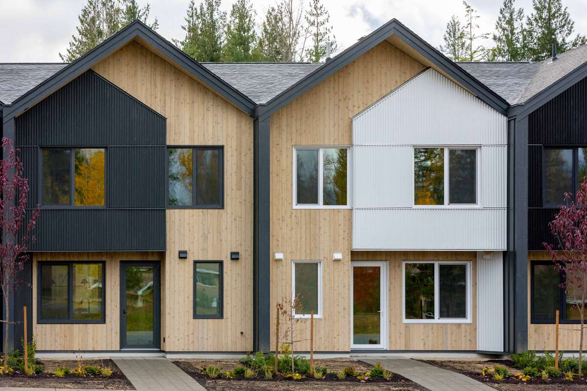 Own your own strata free townhome with backyard