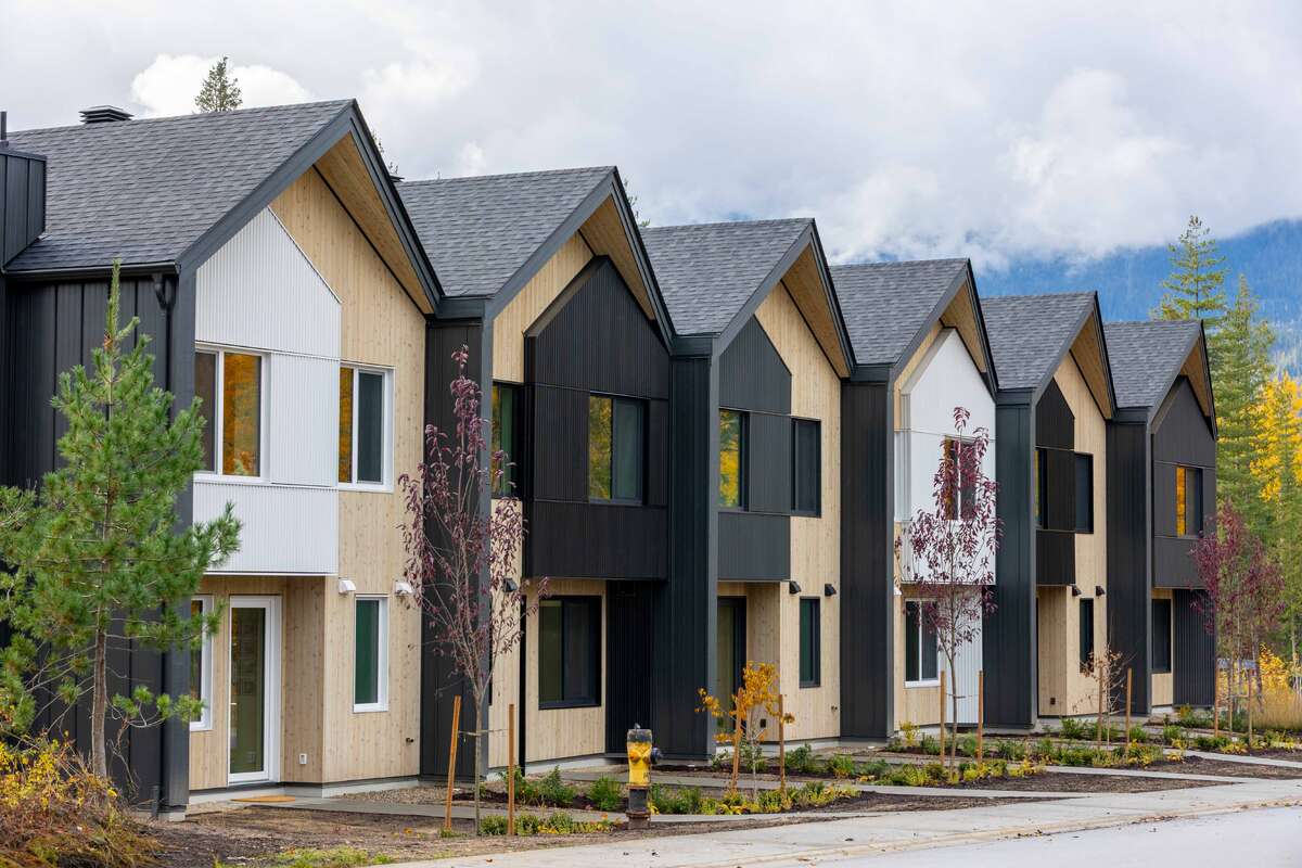 Own your own strata free townhome with backyard