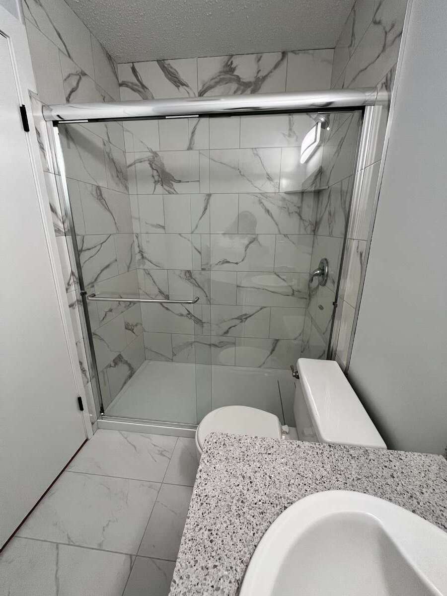 Master bath with new walk-in shower.