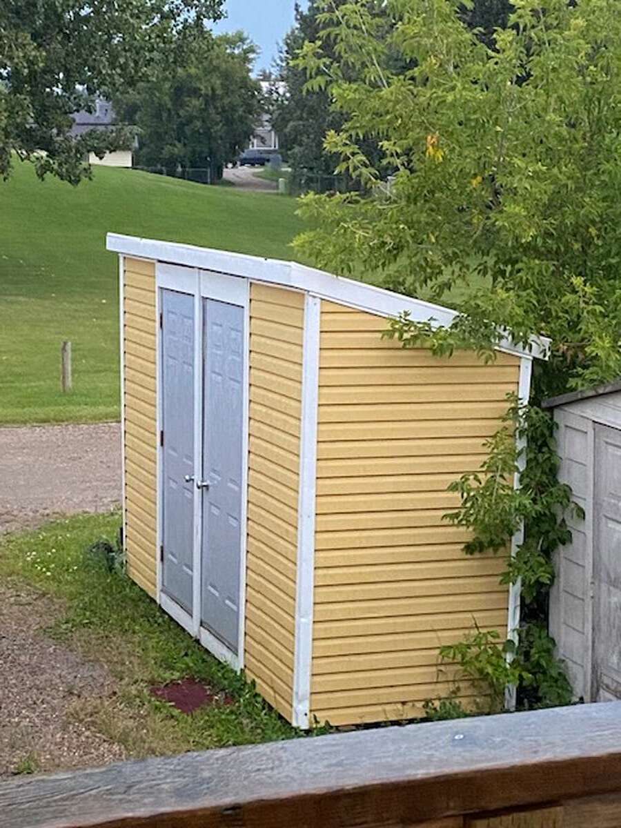 Private storage shed for each unit