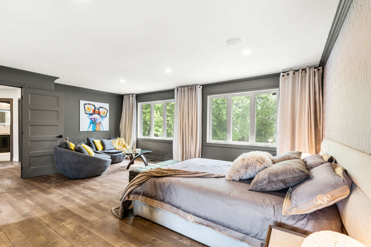 “Luxury Primary Bedroom – Bright, Spacious, and Inviting”