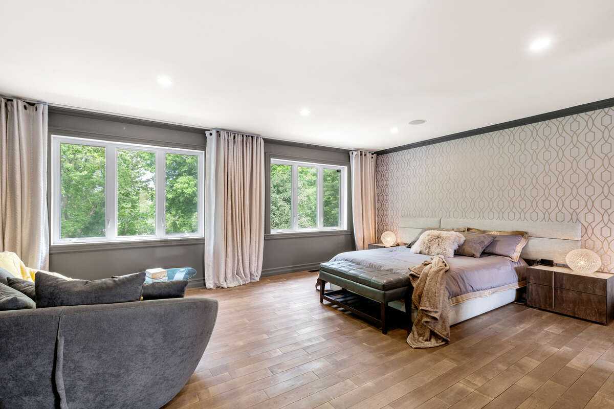 “Luxury Primary Bedroom – Bright, Spacious, and Inviting”