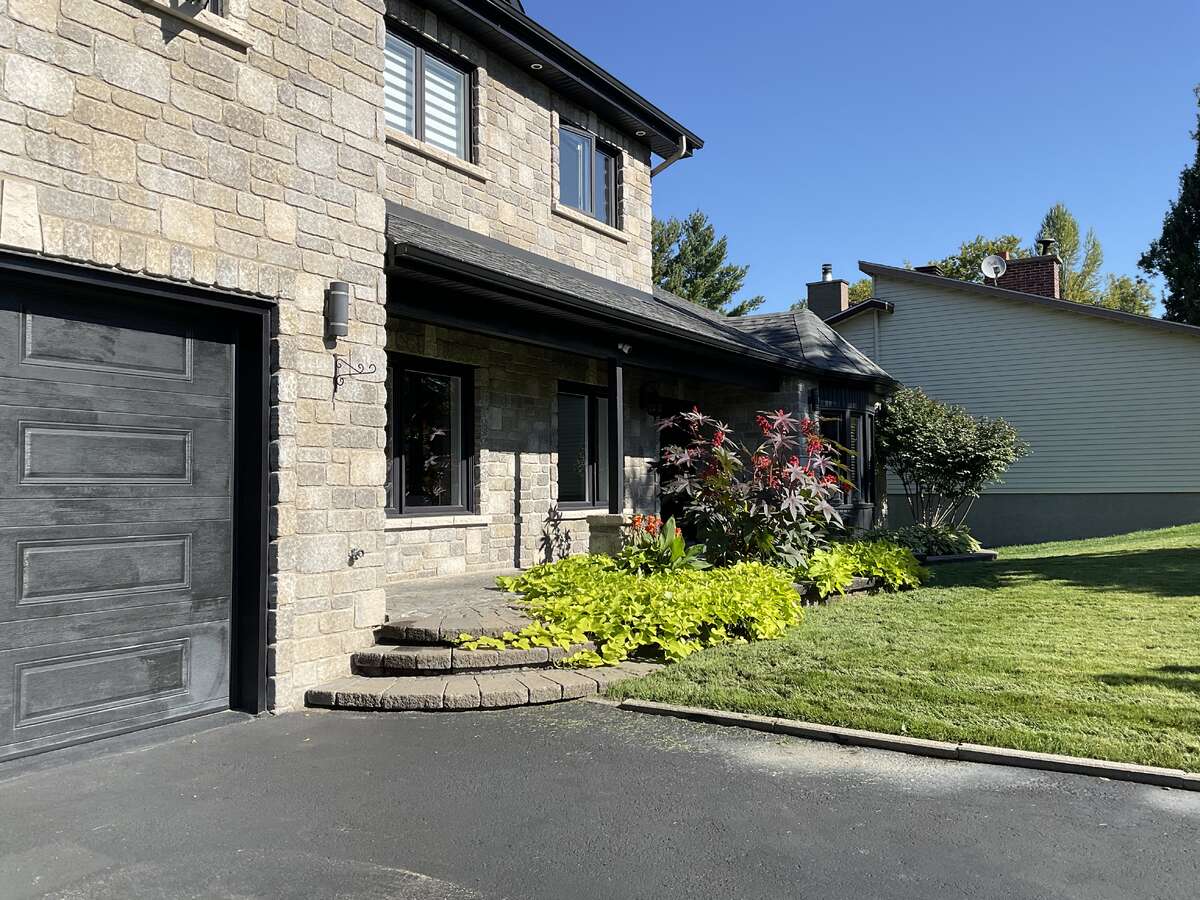 “Elegant Front Façade – Luxury Waterfront Residence”