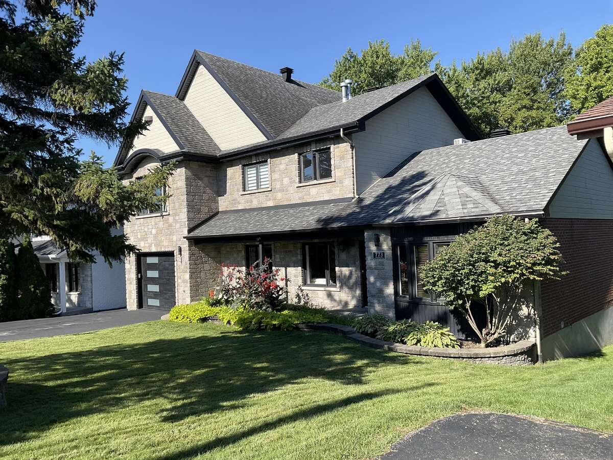 “Elegant Front Façade – Luxury Waterfront Residence”