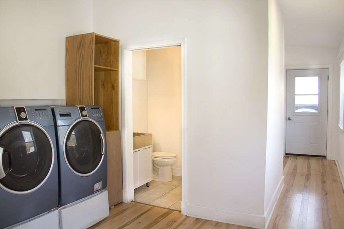 Main floor 3 piece bathroom and laundry with cathedral ceiling.