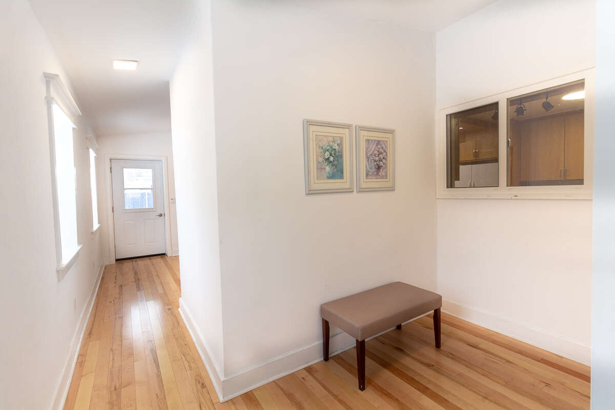 Rear addition with cathedral ceilings and oversized windows.