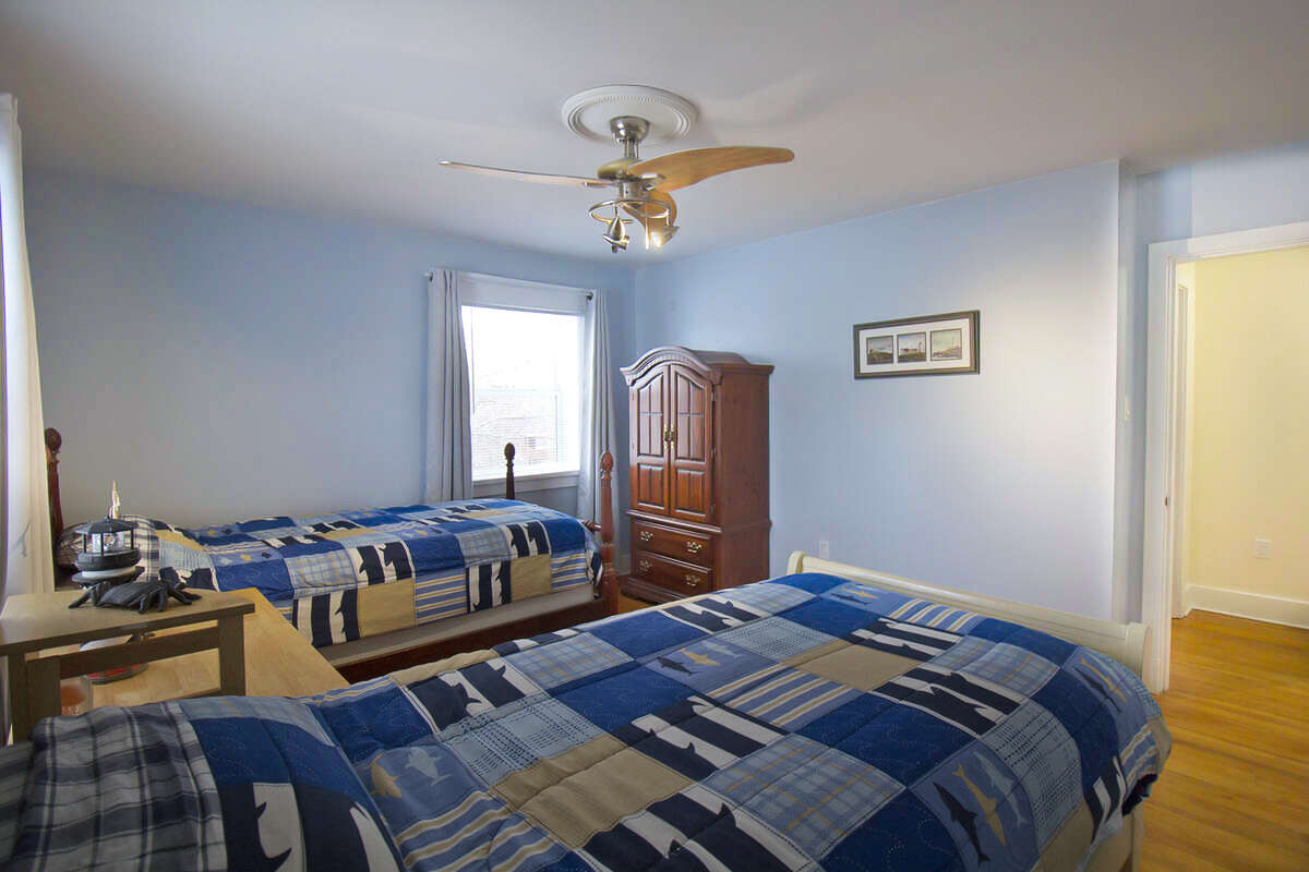 Another bright comfortable upstairs bedroom.