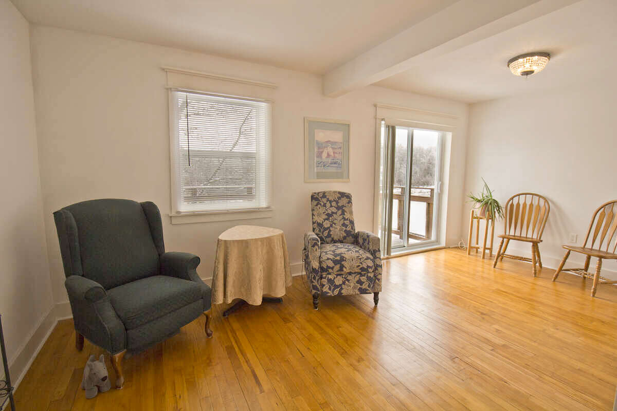 Upper-level family room with flexible use as living space, hobby room, or additional bedroom.