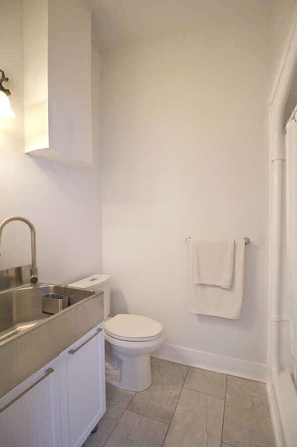 Main floor laundry tub and full bathroom access.