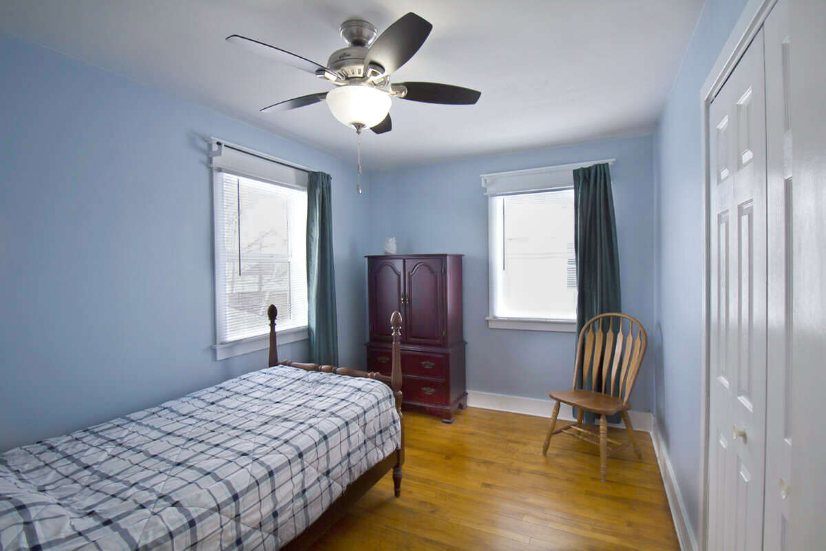 Another bright comfortable upstairs bedroom.