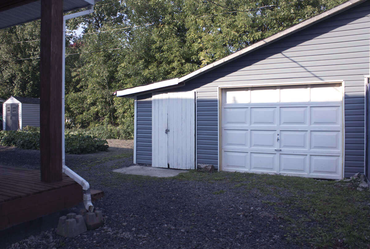 One of 2 garages this one offers storage and a generator room.