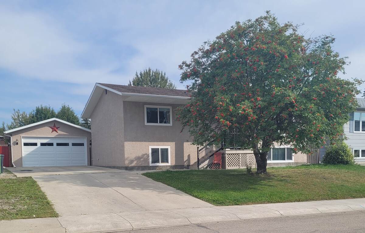 Front of house and garage.
