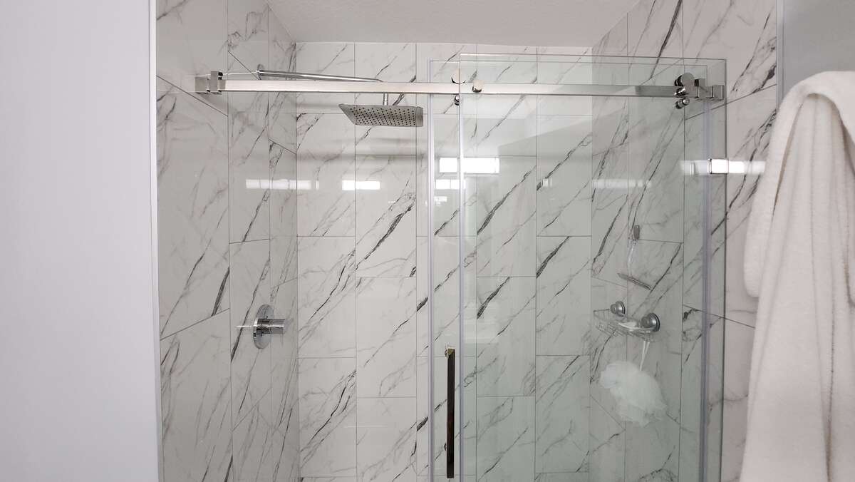 Master Bathroom shower w/ upgraded frameless glass & Moen Rainhead