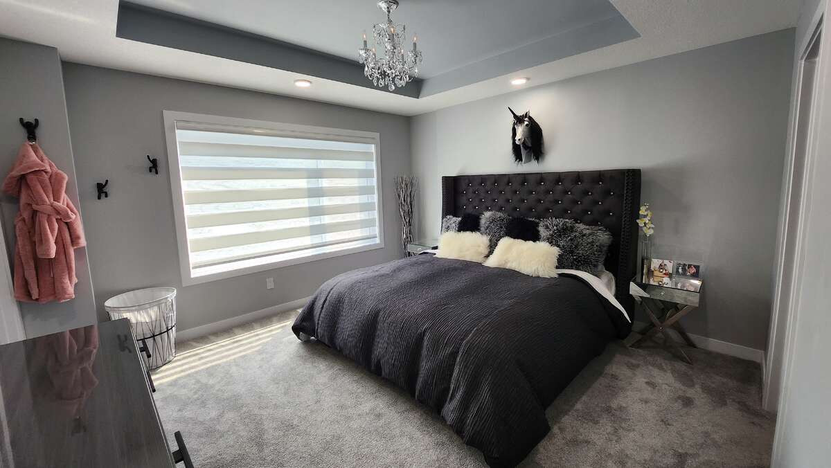 master bedroom features dual blinds ( one is a black out ) * $2000 crystal chandelier
