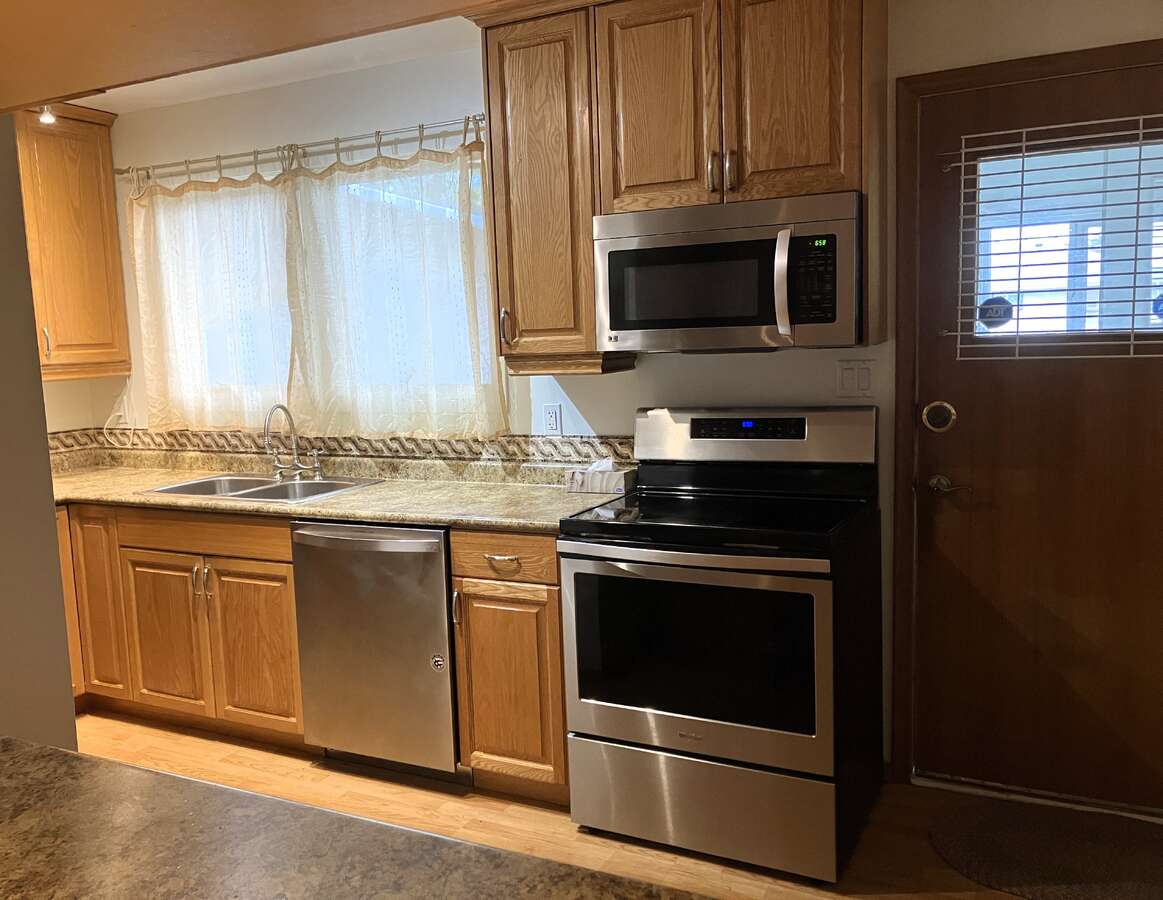 kitchen with entrance to mud room with laundry facilities