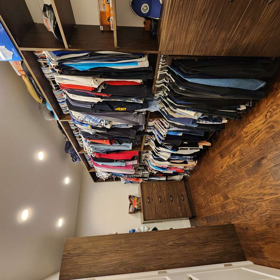 Huge Walk In Closet Complete with Dressers.