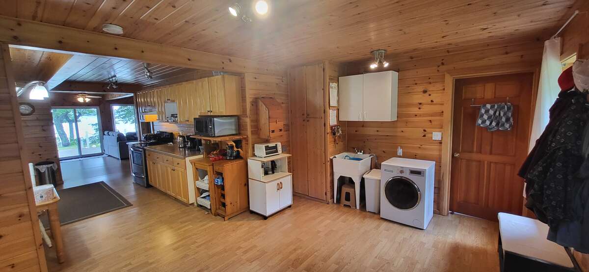 Back lobby, laundry area, entrance to the 3 pieces bathroom.