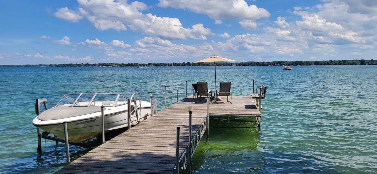 Left dock with boat, and boat lift.