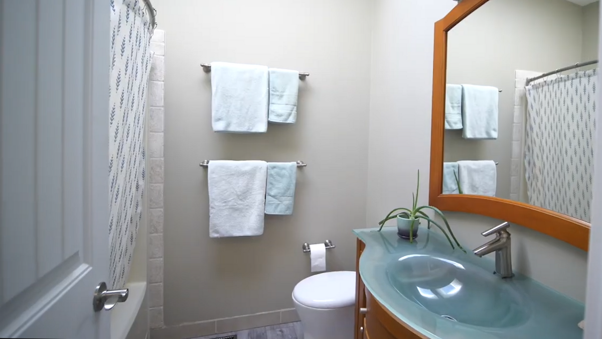 Main bathroom with tub and skylight in the bathroom.