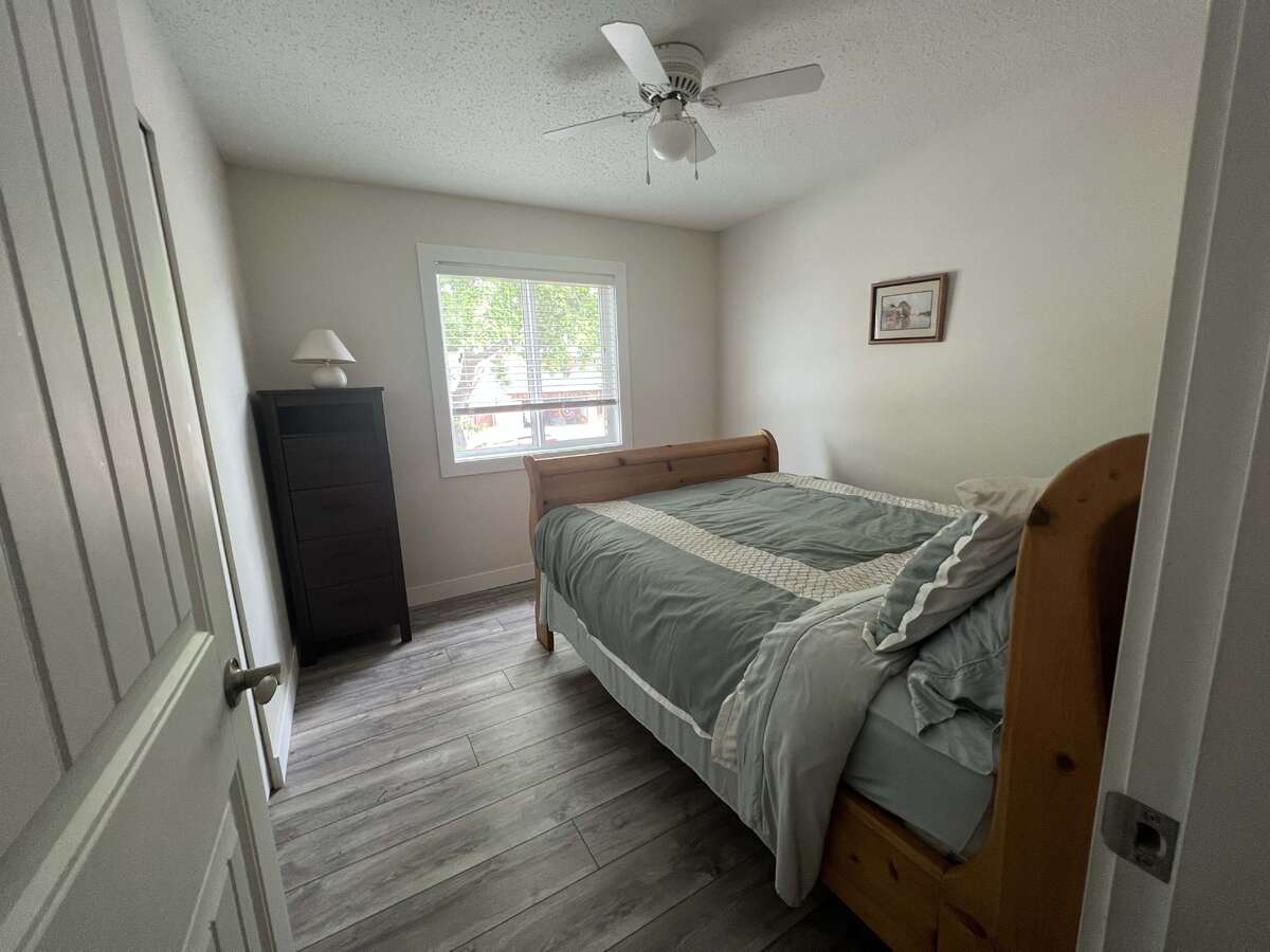 3rd Bedroom showing a Queen Bed.