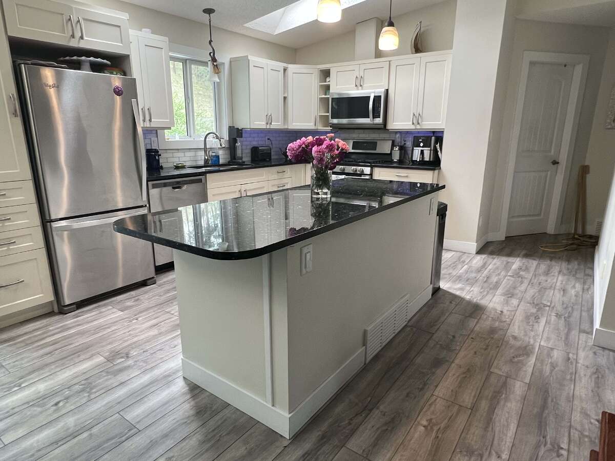 Quartz Counters and lots of room around the island for lots of cooks