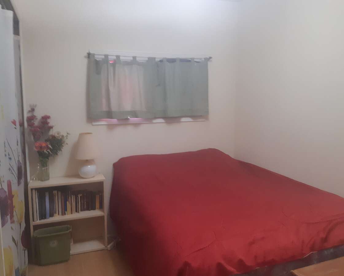 Laundry area with door to closet with shelves