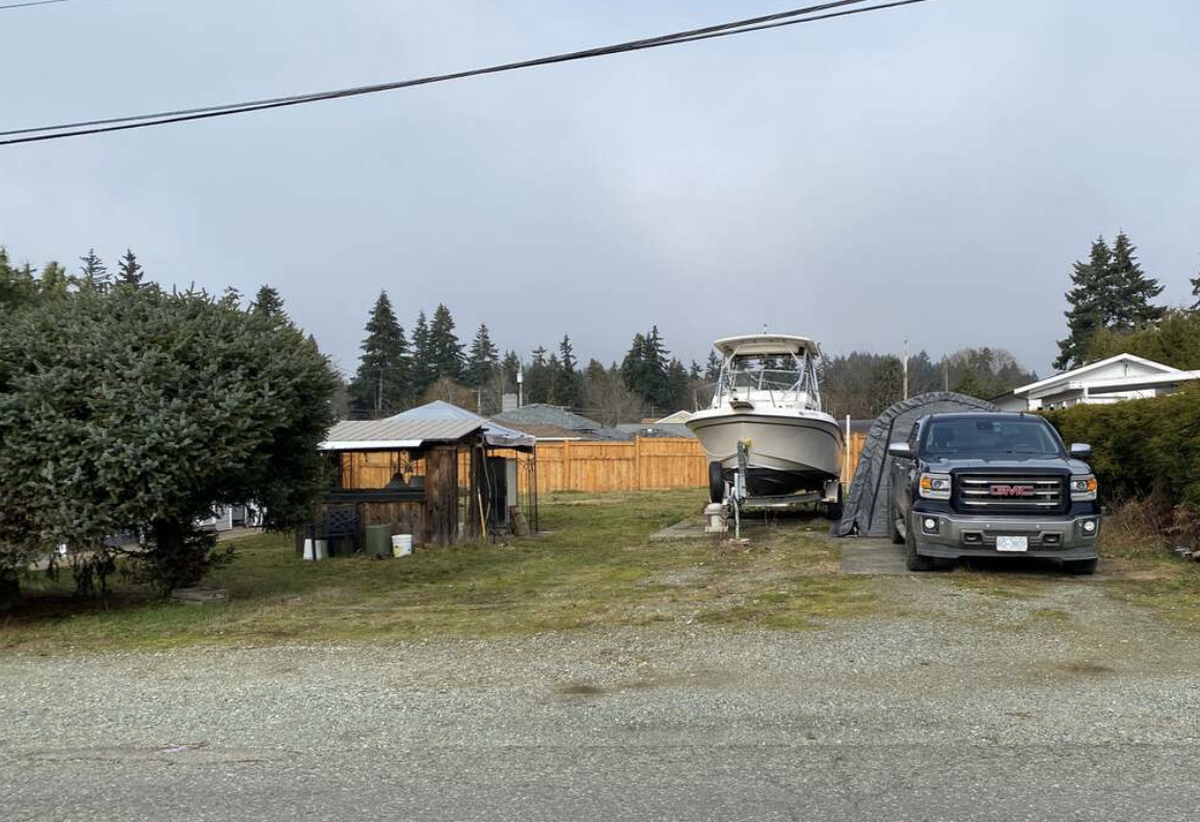 Cleared, level lot with brand new partial fencing and privacy hedge