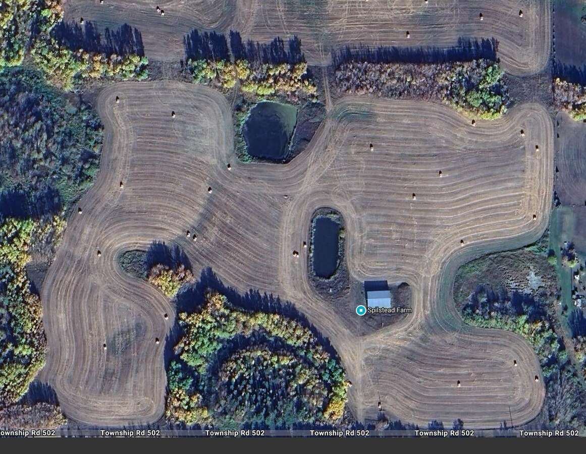 South portion of 80 acre field.  Two dugouts.  Machine storage building.