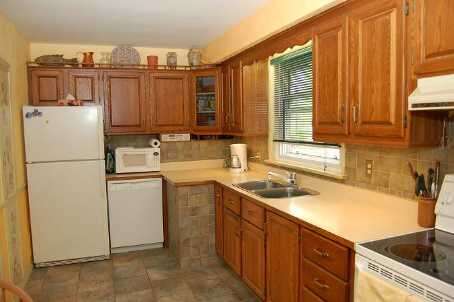 Bright and charming brick bungalow on large lot