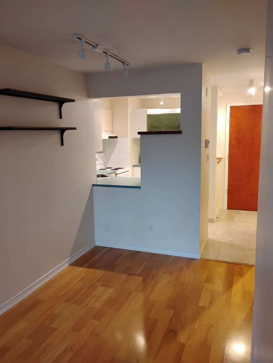 Looking from Living area towards dining area, kitchen and entrance.