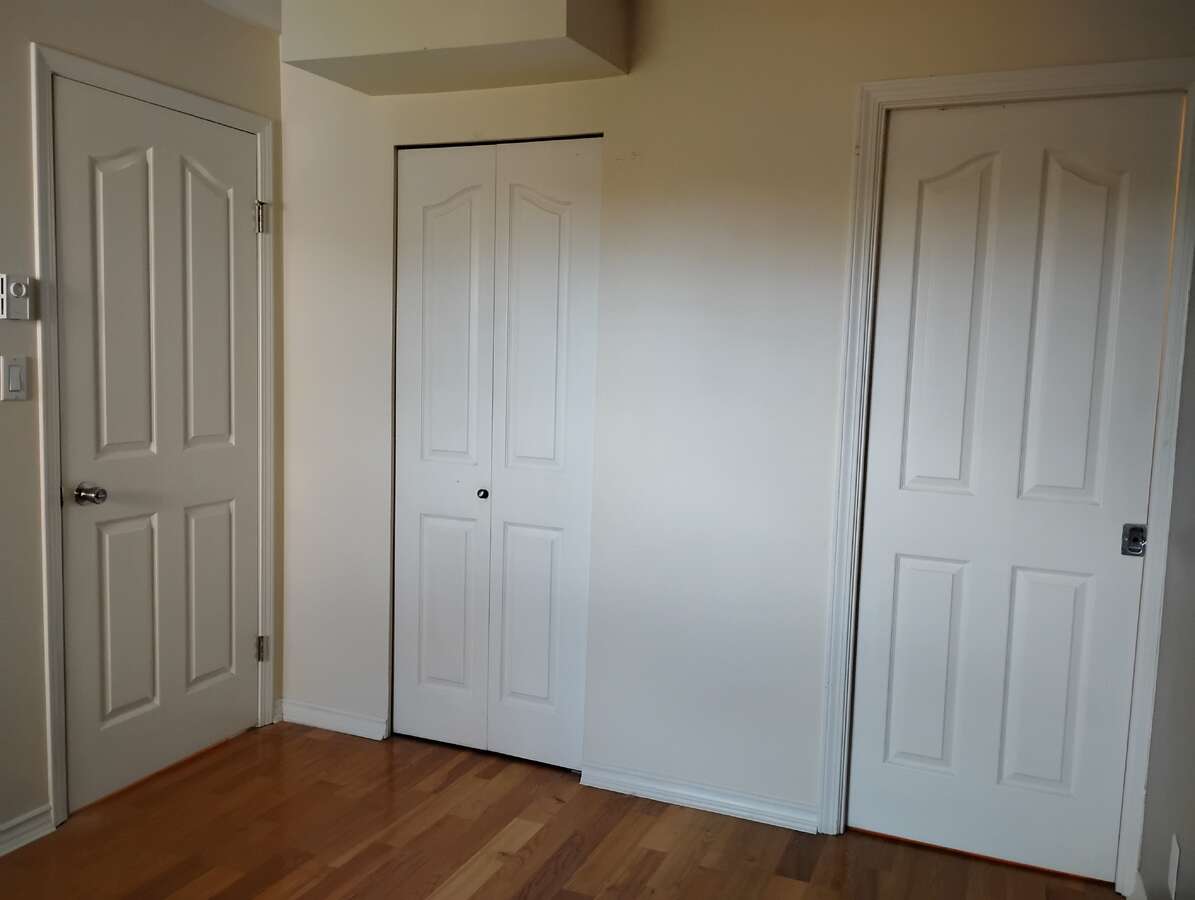 Bedroom 1 showing main door, small closet and walk in closet