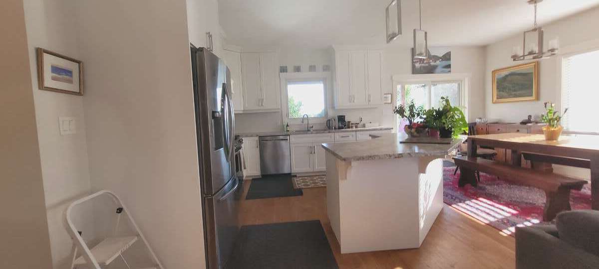 bright kitchen,  dining, and walkout to covered porch