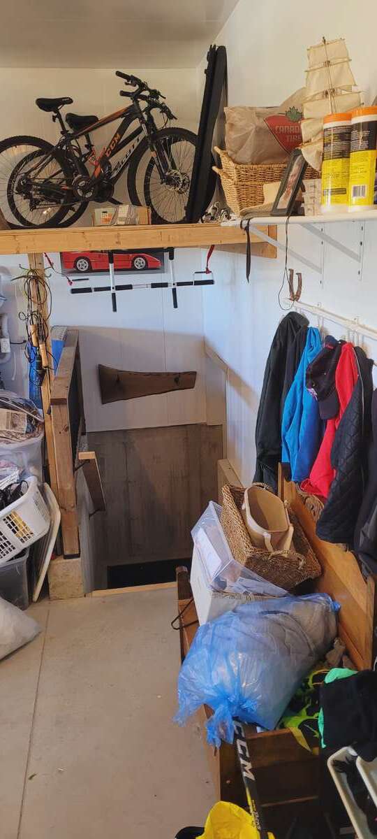overhead garage  storage and basement access stairwell