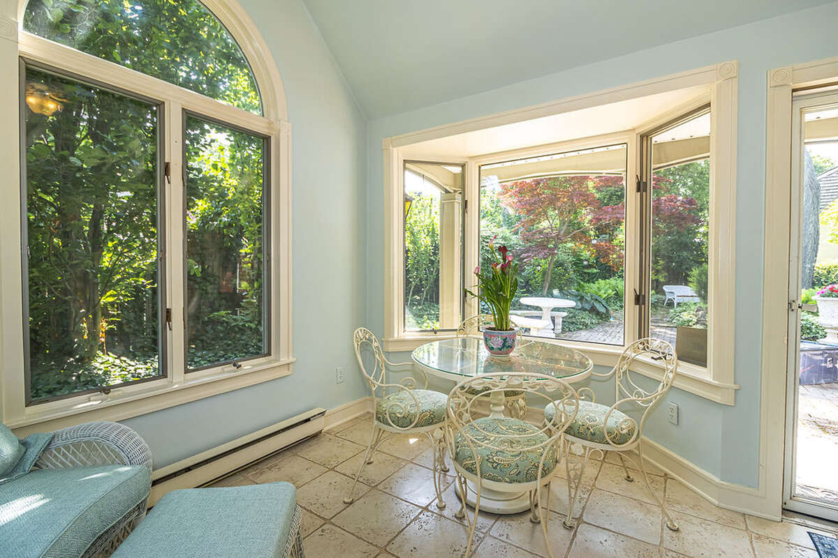 Sunroom - vaulted ceilings, large windows on every wall, and direct access to the garden