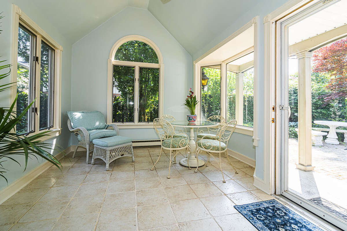 Sunroom - vaulted ceilings, large windows on every wall, and direct access to the garden