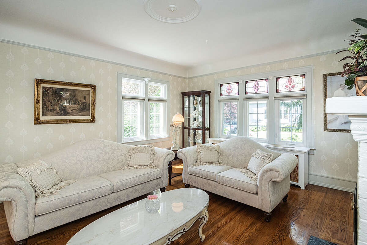 natural fireplace, coved ceilings, new windows, custom stained glass.