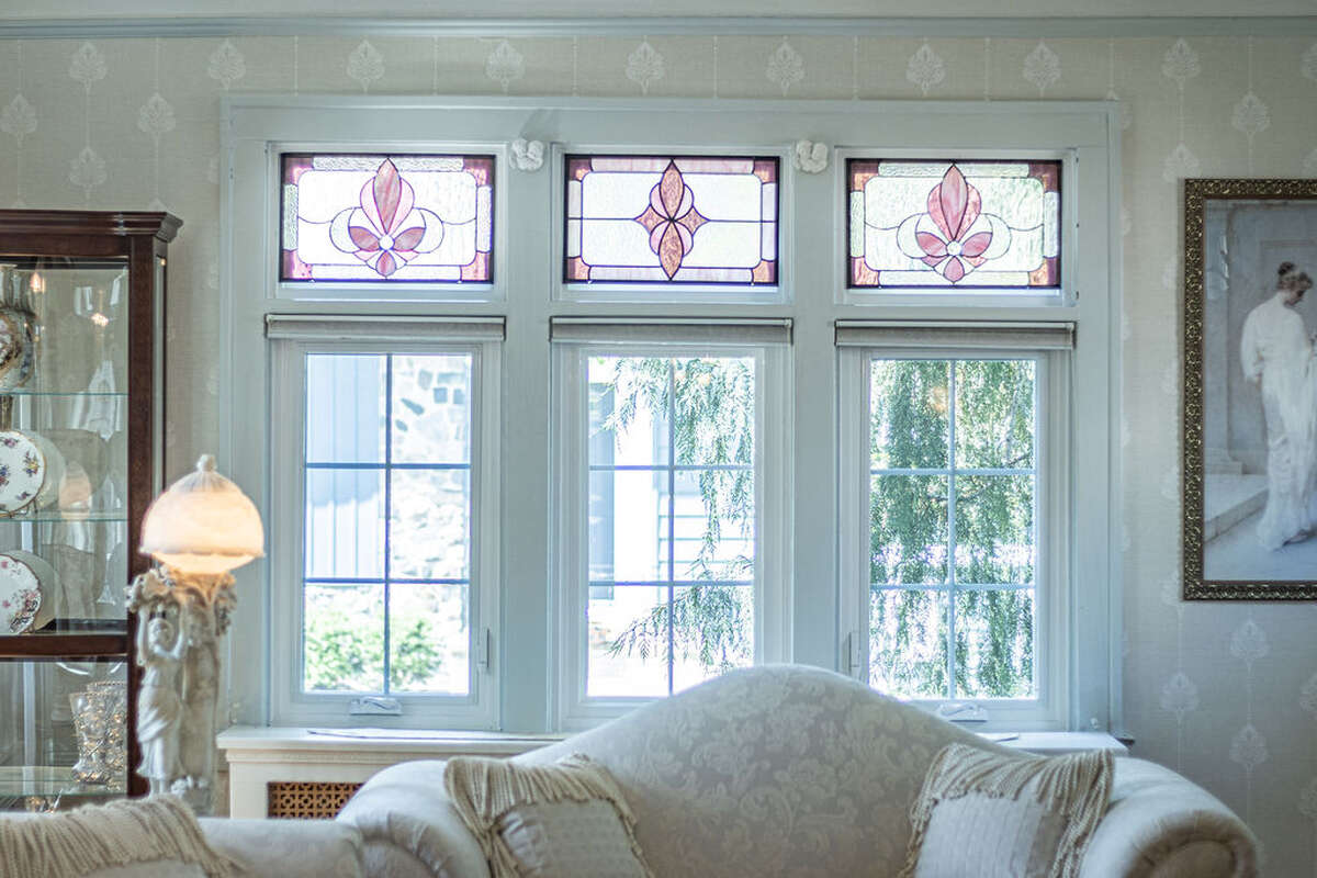 natural fireplace, coved ceilings, new windows, custom stained glass.