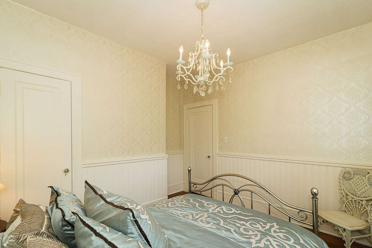 quiet and peaceful space, featuring a bay window overlooking the garden, classic wainscoting