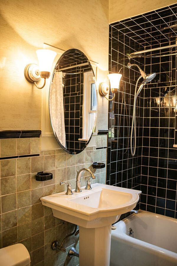 main floor bathroom features vintage tiles in mint condition