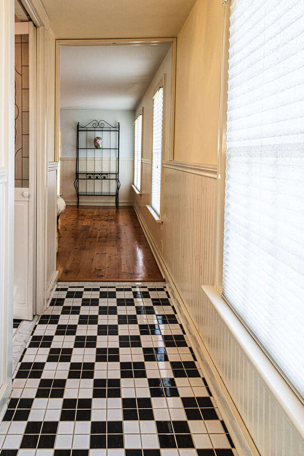 Top floor hallway with classic black and white tiles