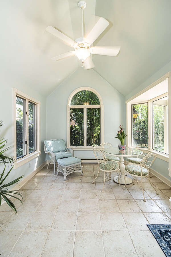 Sunroom - vaulted ceilings, large windows on every wall, and direct access to the garden