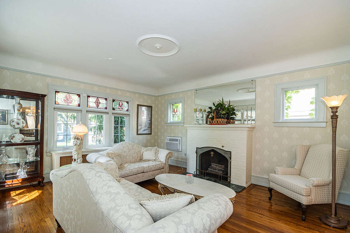 natural fireplace, coved ceilings, new windows, custom stained glass.