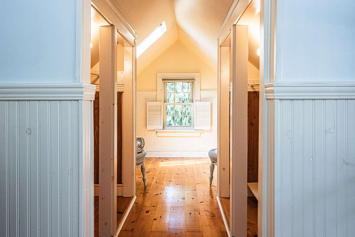 two double cedar lined closets, a cozy office or meditation nook w/ skylight