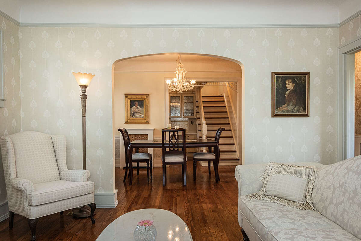 natural fireplace, coved ceilings, new windows, custom stained glass.