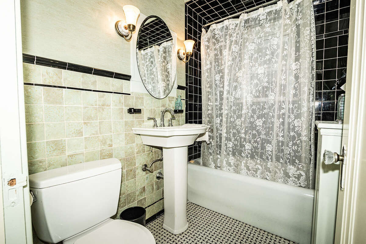 main floor bathroom features vintage tiles in mint condition