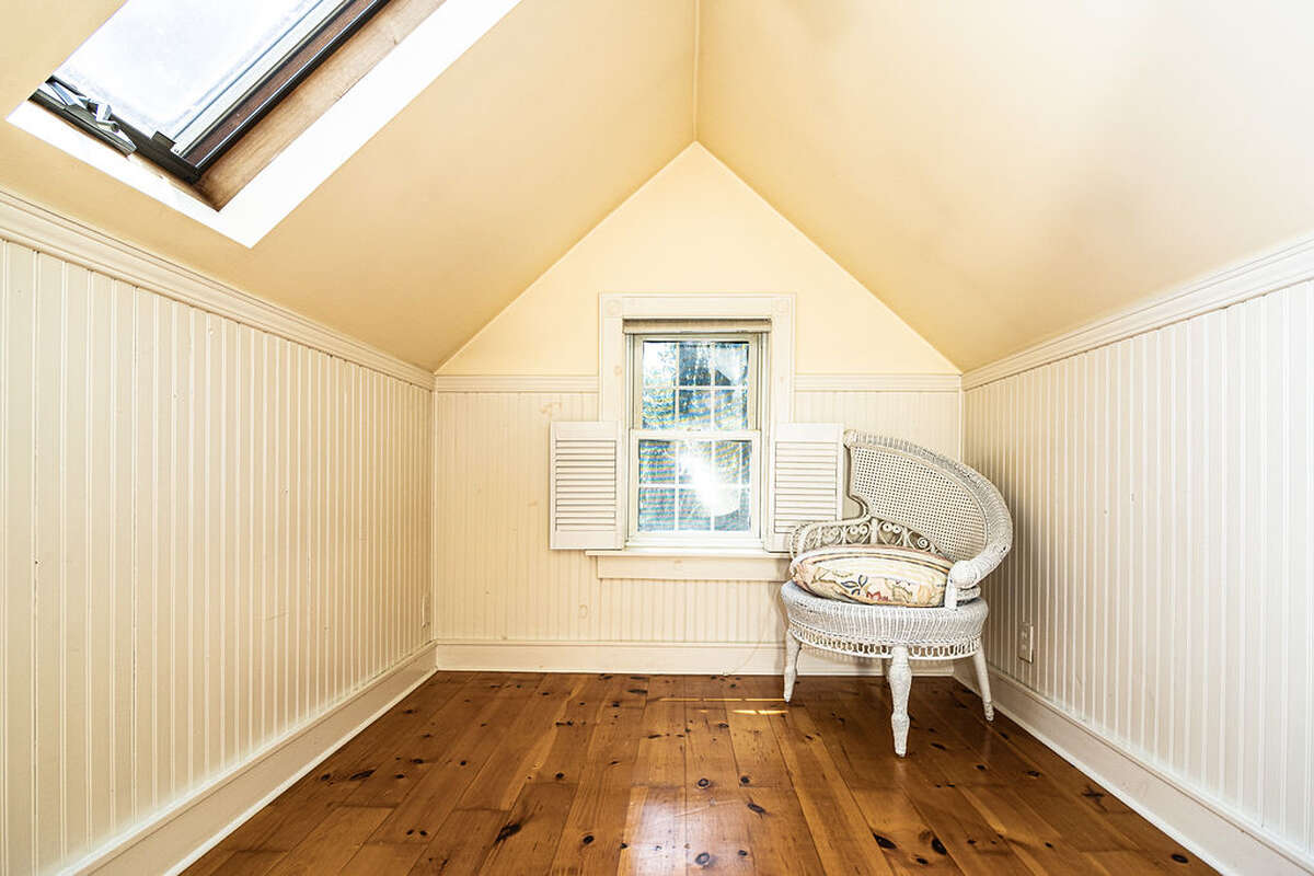 two double cedar lined closets, a cozy office or meditation nook w/ skylight