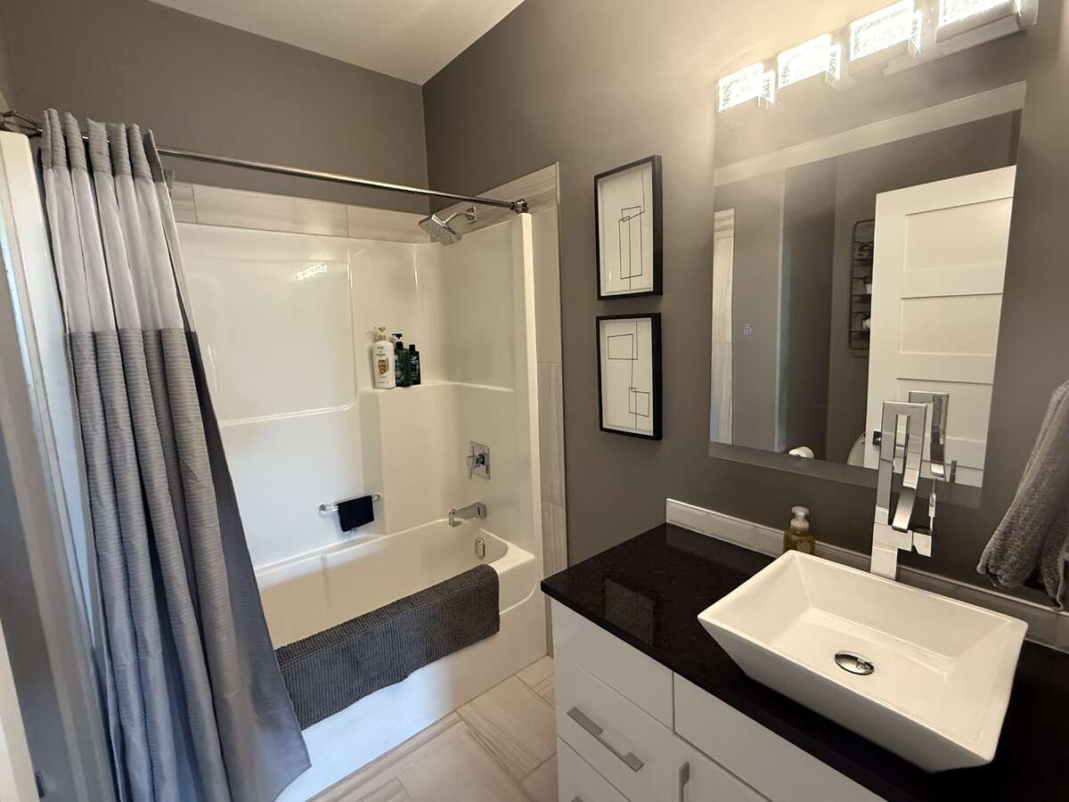 main floor bathroom with bluetooth mirror