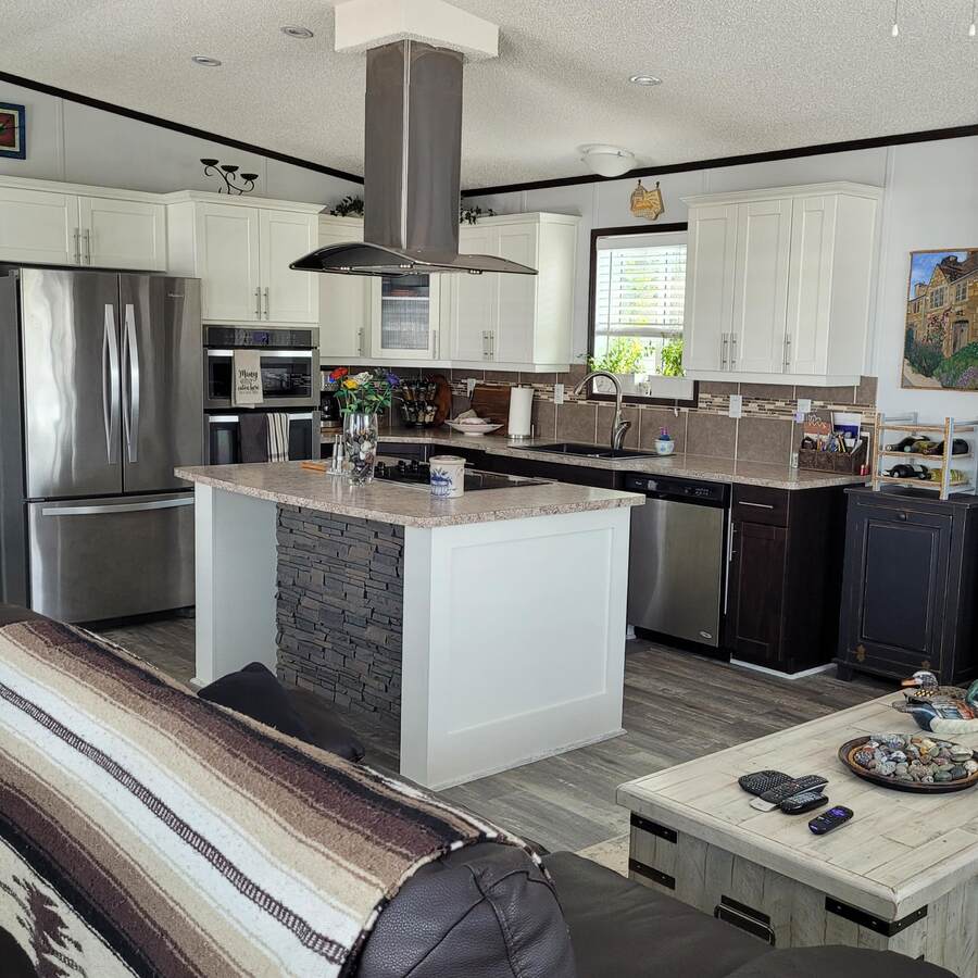 Kitchen area with vaulted ceiling.