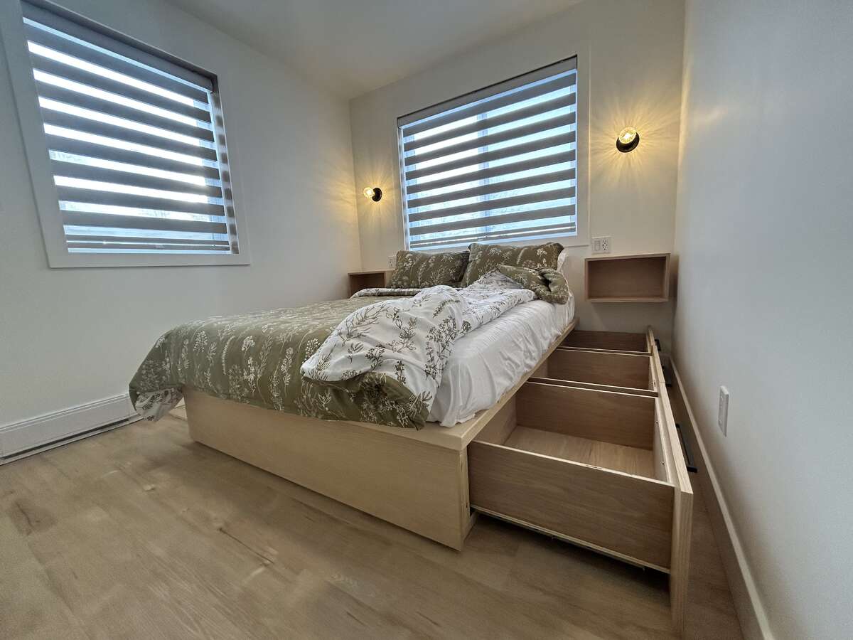 Storage builtin to both sides of the bed